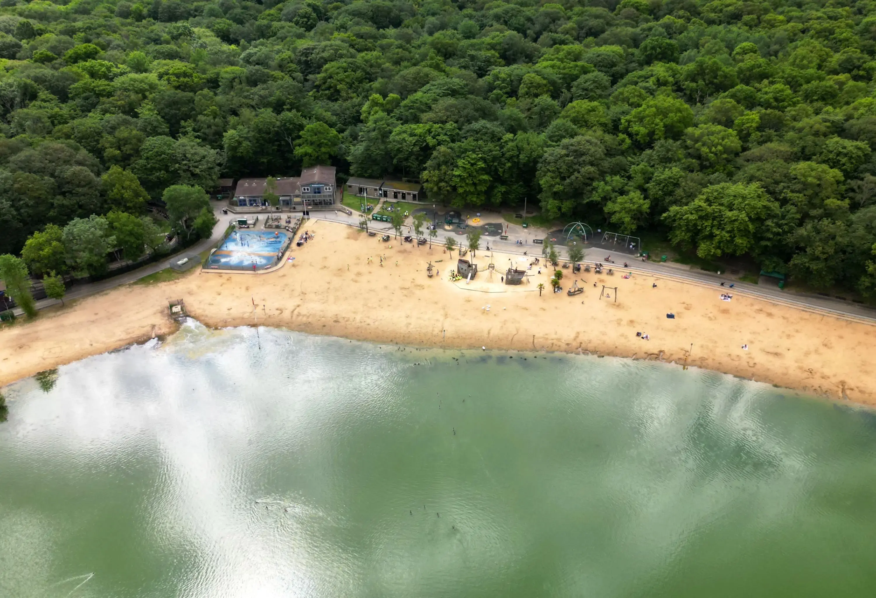 Aerial view of Ruislip Lido beach in West London on an overcast day in summer