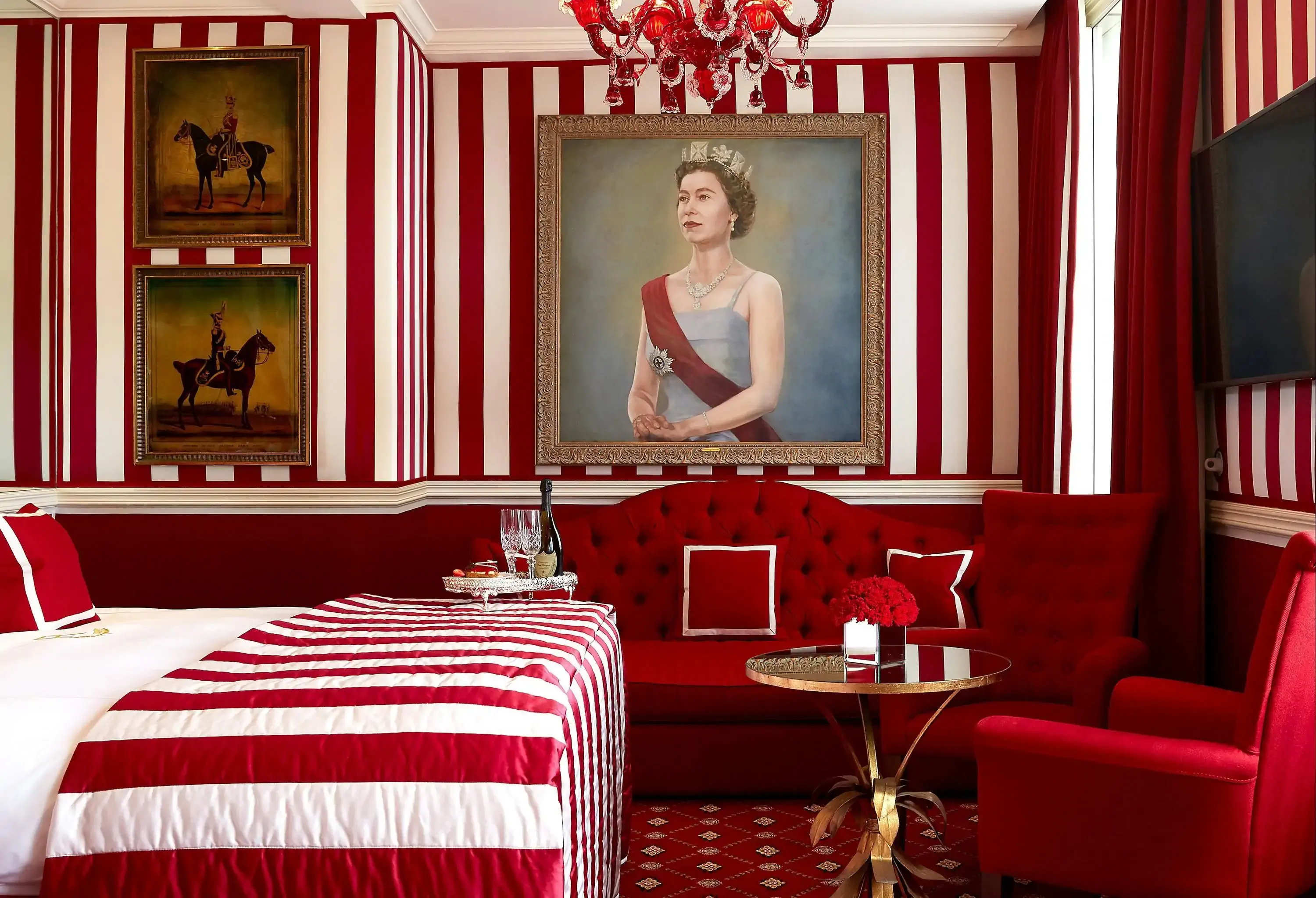 Classic eclectic red and white luxurious hotel room with portrait of a queen