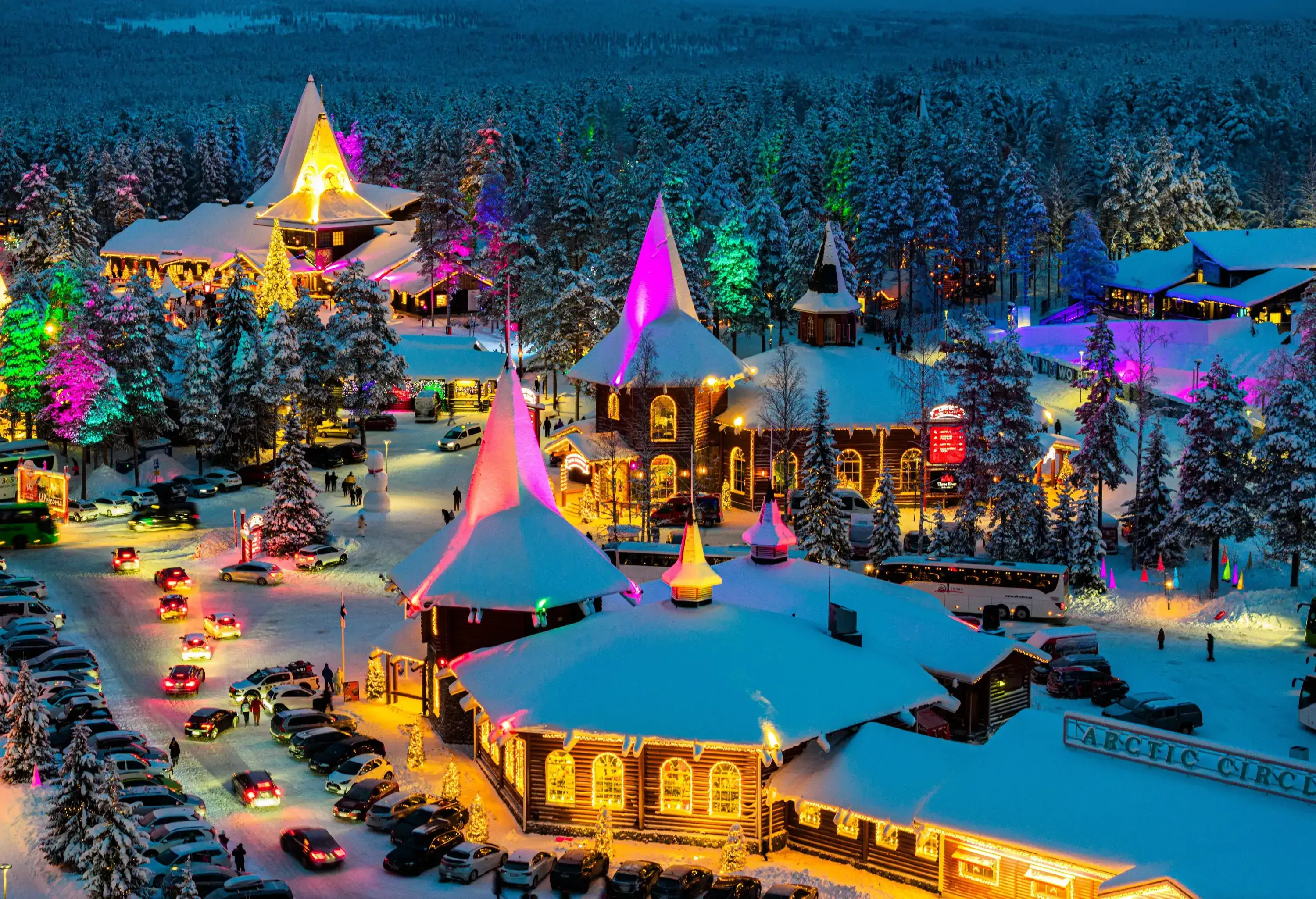 Aerial view of Santa Claus Village amusement park and Christmas markets at night, Rovaniemi, Lapland, Finland