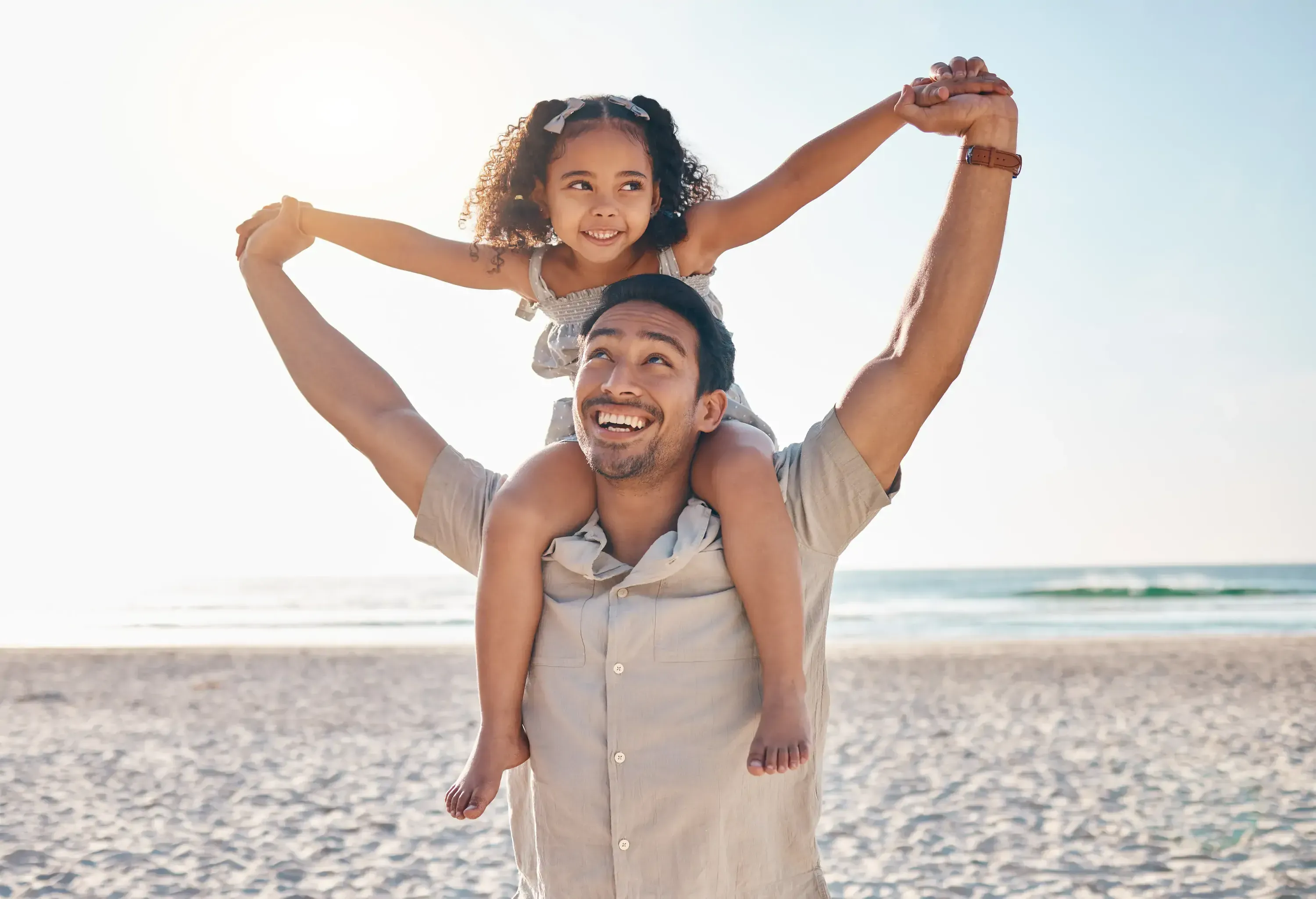 Airplane, love and father with girl at beach for travel, freedom or family vacation on blue sky background. Flying, care and man parent with kid at the sea for piggyback, games or traveling in Cancun