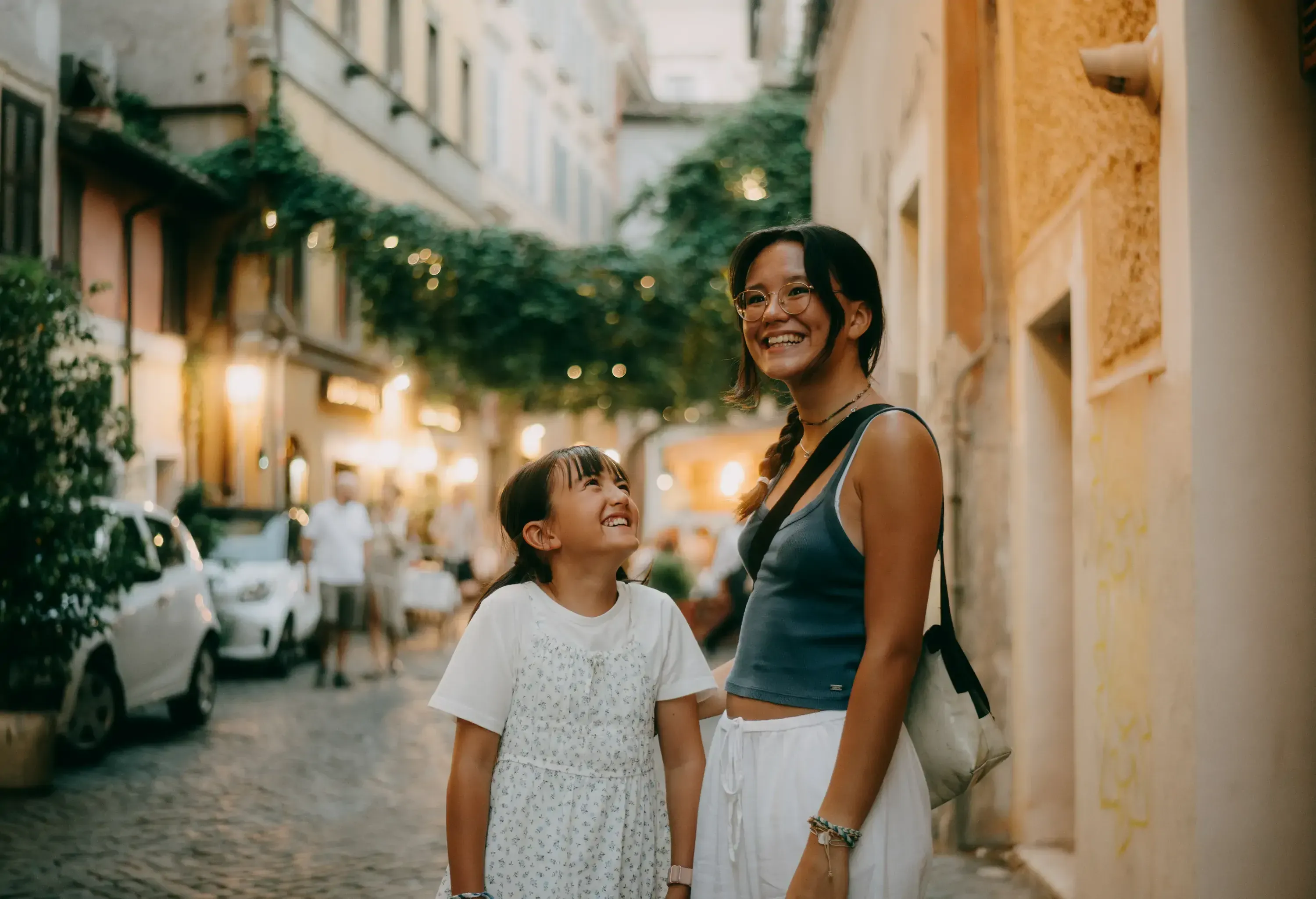 Eurasian sisters having a good time in city, Rome, Italy