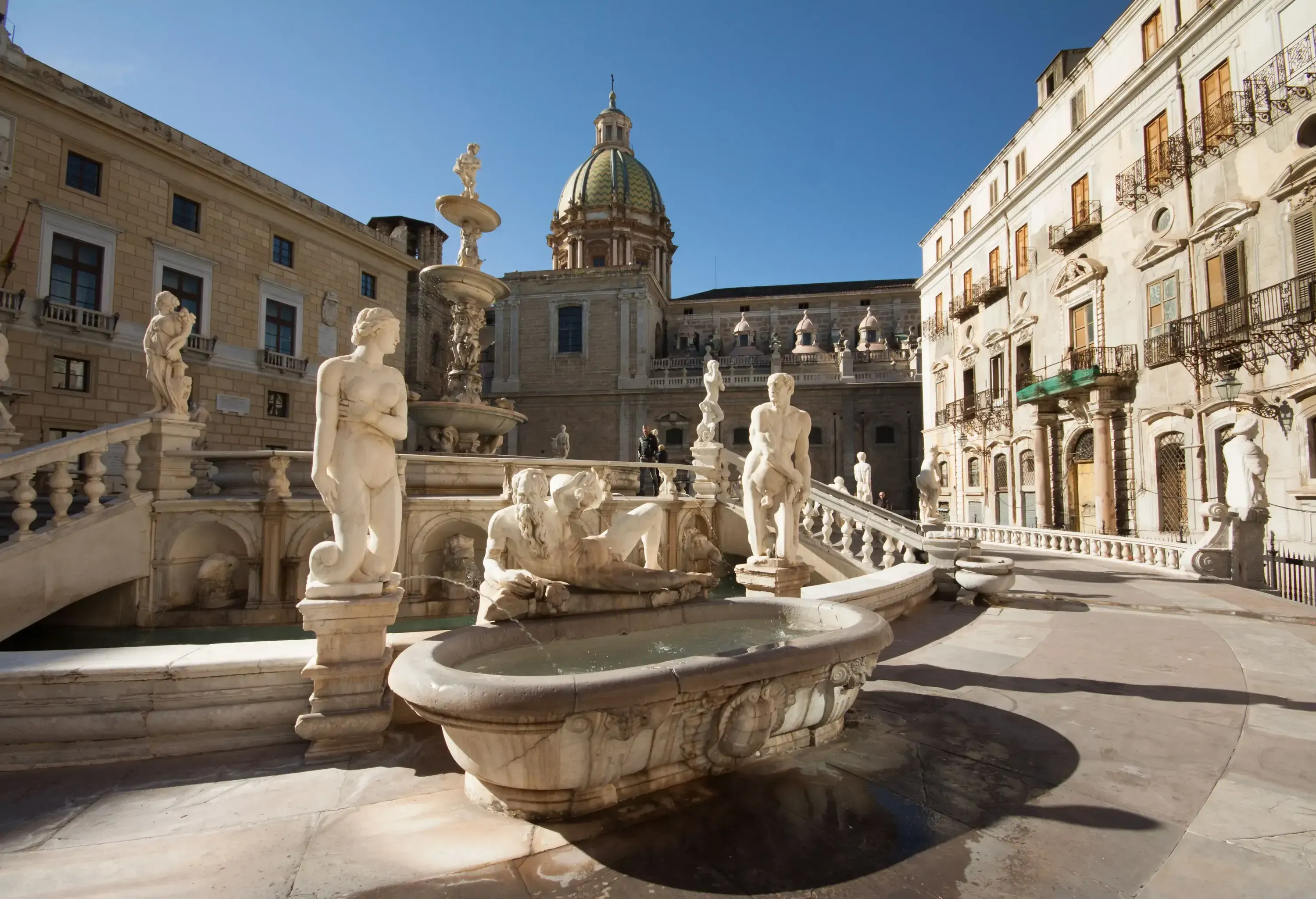 A city square famous for its grand fountain, called Fontana Pretoria, which features intricate carvings and numerous statues.
